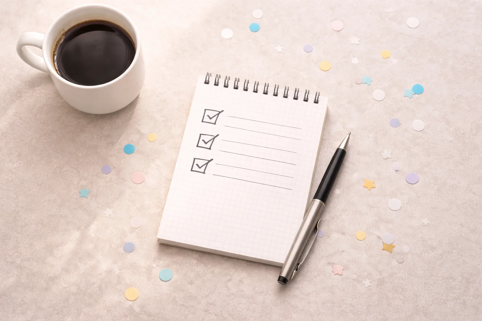 “Interview-day flat lay with notepad, pen, and coffee on a neutral desk.”